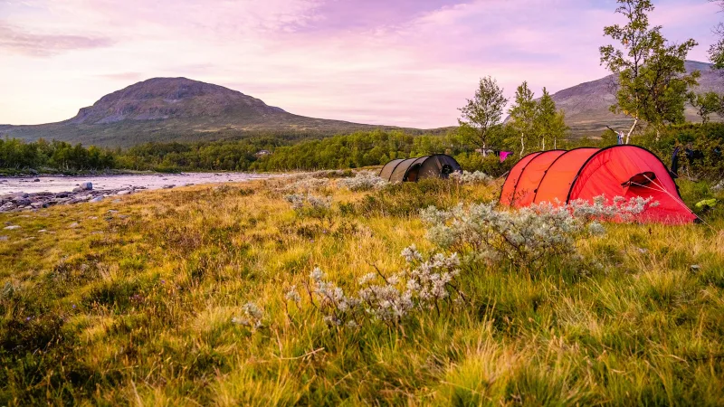 A red and orange camping tent