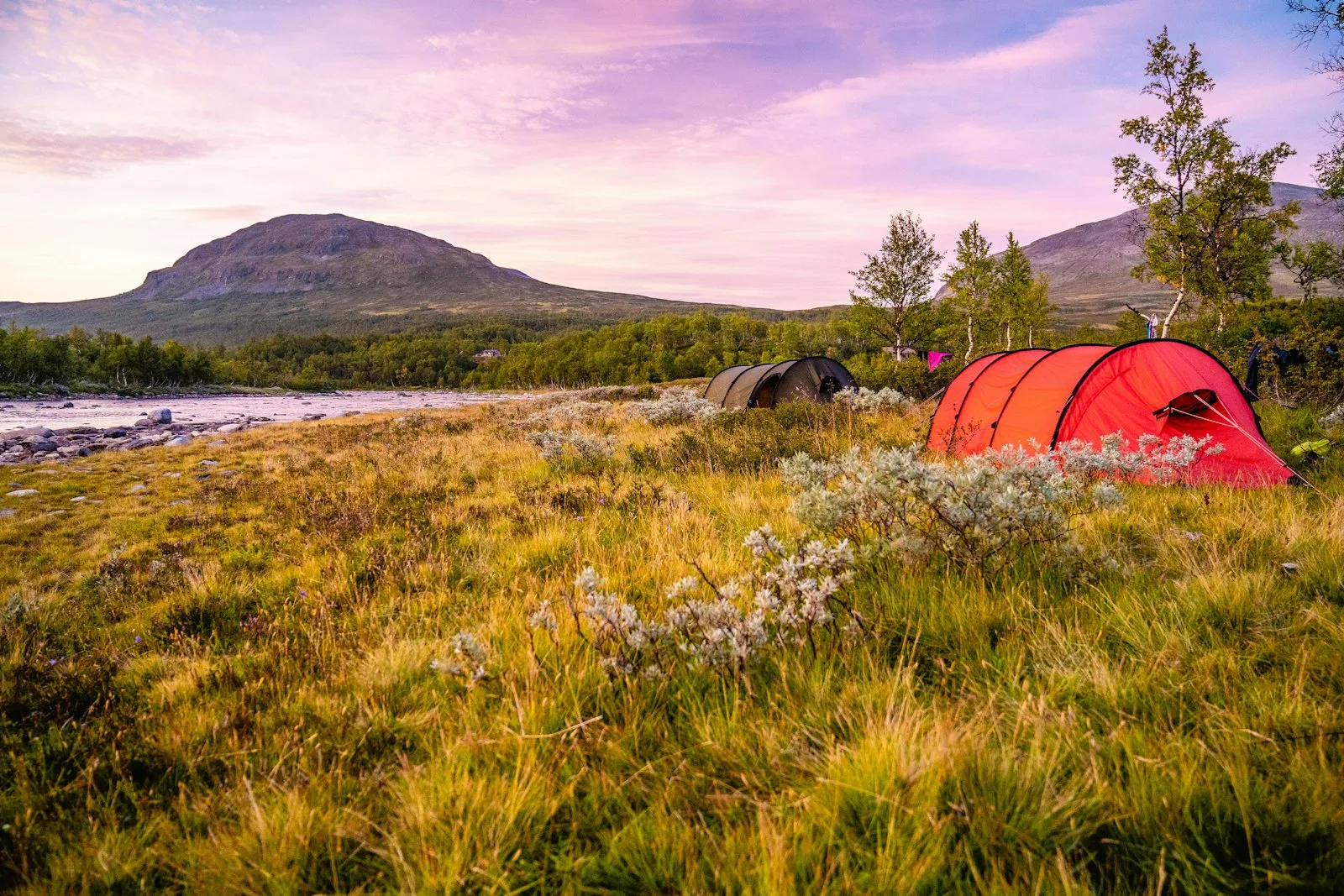 A red and orange camping tent