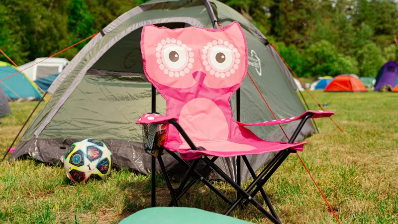 Camping gear laid out on a grassy field